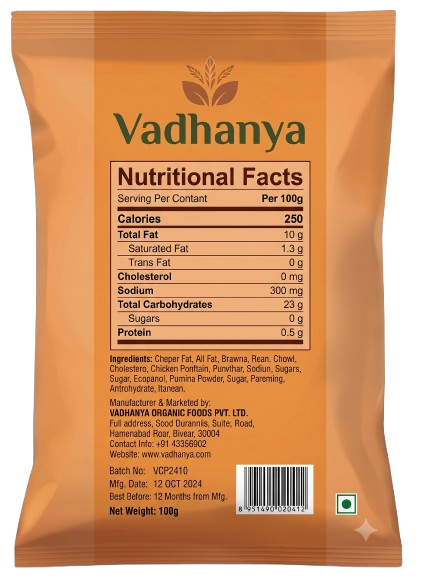 Back view of a Vadhanya branded orange pouch showing the nutritional facts panel, ingredients, manufacturer details, and a barcode on a plain white background.