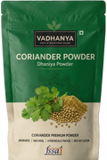 Vadhanya Coriander Powder Dhaniya Powder in a green and beige resealable stand-up pouch with a coriander leaf and coriander seeds illustration on the front, and an FSSAI logo at the bottom.