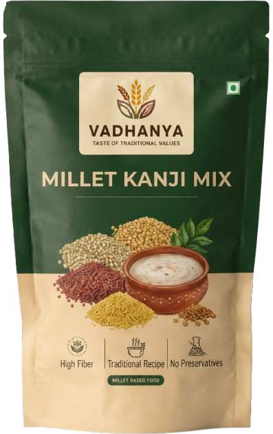 Vadhanya Millet Kanji Mix in a resealable stand-up pouch. The packaging features a dark green top half and a beige bottom half, with an illustration of various millet grains, a bowl of milky mixture, and text highlighting high fiber, traditional recipe, and no preservatives.