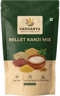 Vadhanya Millet Kanji Mix in a resealable stand-up pouch. The packaging features a dark green top half and a beige bottom half, with an illustration of various millet grains, a bowl of milky mixture, and text highlighting high fiber, traditional recipe, and no preservatives.